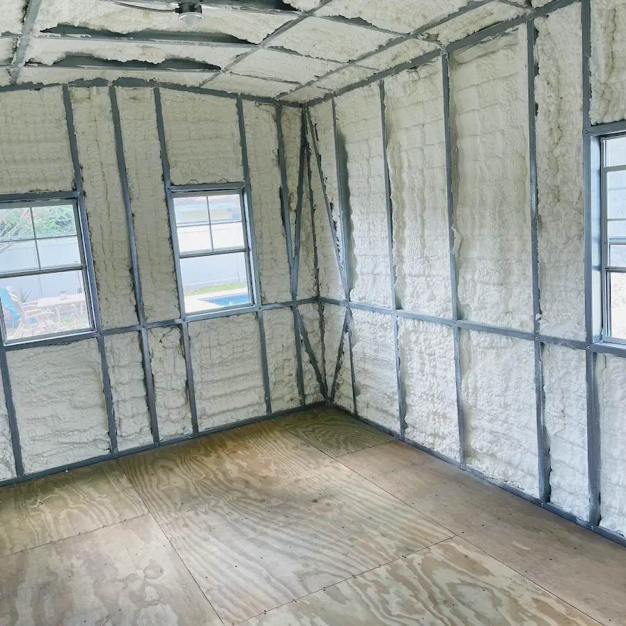 Closed-cell spray foam insulation applied to wall cavities in a residential project in Branford